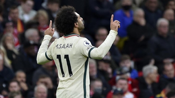 Liverpools Mohamed Salah celebrates after scoring his sides third goal during the English Premier League soccer match between Manchester United and Liverpool at Old Trafford in Manchester, England, Sunday, Oct. 24, 2021. (AP Photo/Rui Vieira)