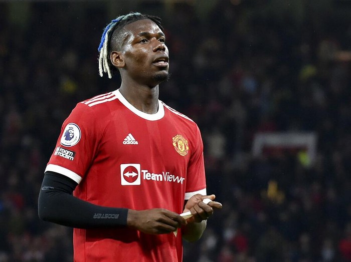 Manchester United's Paul Pogba leaves the pitch after being shown a red card during the English Premier League soccer match between Manchester United and Liverpool at Old Trafford in Manchester, England, Sunday, Oct. 24, 2021. (AP Photo/Rui Vieira)