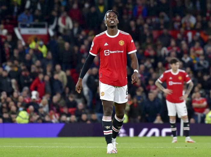 Manchester United's Paul Pogba leaves the pitch after being shown a red card during the English Premier League soccer match between Manchester United and Liverpool at Old Trafford in Manchester, England, Sunday, Oct. 24, 2021. (AP Photo/Rui Vieira)