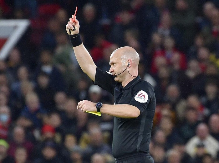 Manchester United's Paul Pogba leaves the pitch after being shown a red card during the English Premier League soccer match between Manchester United and Liverpool at Old Trafford in Manchester, England, Sunday, Oct. 24, 2021. (AP Photo/Rui Vieira)