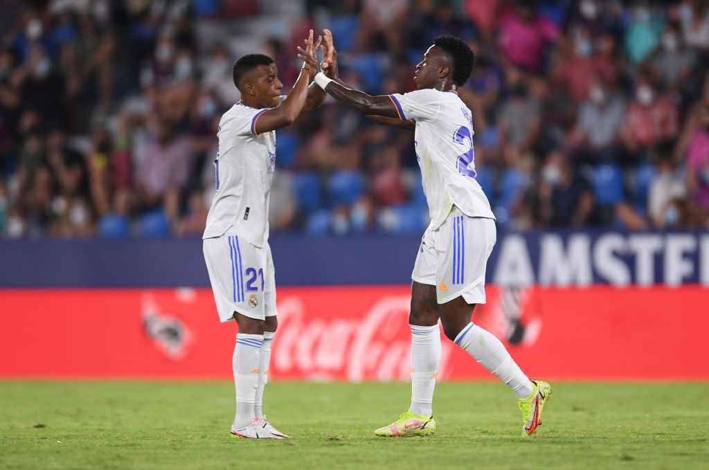 VALENCIA, SPAIN - AUGUST 22: Vinicius Junior (R) of Real Madrid celebrates with Rodrygo after scoring their team's second goal during the LaLiga Santander match between Levante UD and Real Madrid CF at Ciutat de Valencia Stadium on August 22, 2021 in Valencia, Spain . (Photo by Aitor Alcalde/Getty Images)