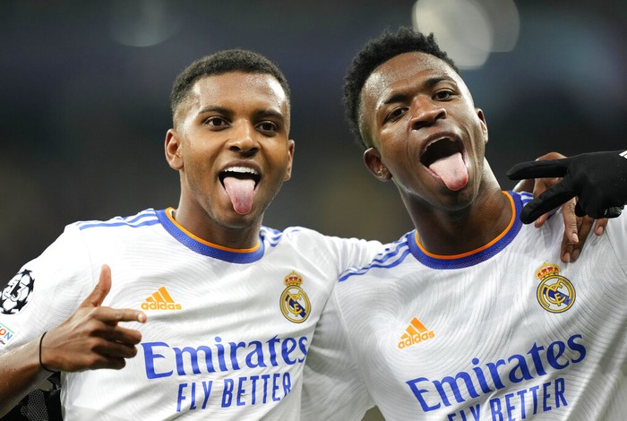 Real Madrids Rodrygo, left, celebrates with Real Madrids Vinicius Junior after scoring his sides fourth goal during the Champions League group D soccer match between Shakhtar Donetsk and Real Madrid at the Olympiyskiy stadium in Kyiv, Ukraine, Tuesday, Oct. 19, 2021. (AP Photo/Efrem Lukatsky)