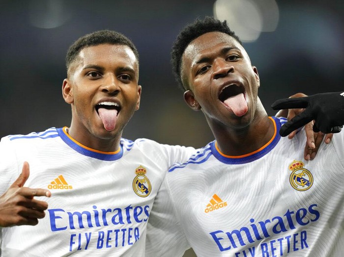 Real Madrid's Rodrygo, left, celebrates with Real Madrid's Vinicius Junior after scoring his side's fourth goal during the Champions League group D soccer match between Shakhtar Donetsk and Real Madrid at the Olympiyskiy stadium in Kyiv, Ukraine, Tuesday, Oct. 19, 2021. (AP Photo/Efrem Lukatsky)
