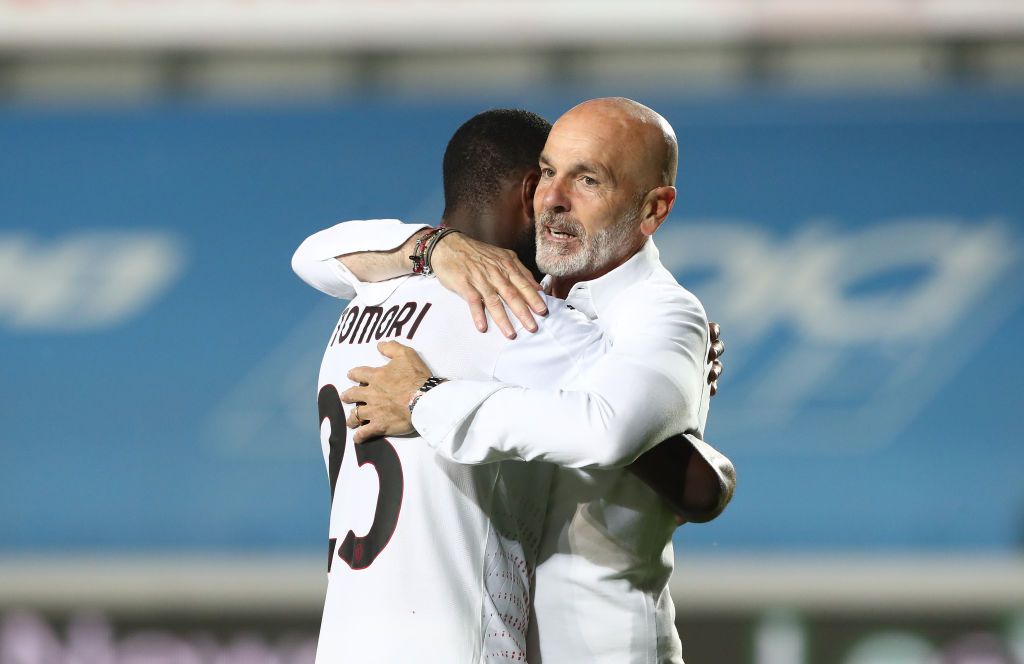 BERGAMO, ITALY - MAY 23: Stefano Pioli, Head Coach of A.C. Milan embraces Fikayo Tomori of A.C. Milan following the Serie A match between Atalanta BC and AC Milan at Gewiss Stadium on May 23, 2021 in Bergamo, Italy. Sporting stadiums around Italy remain under strict restrictions due to the Coronavirus Pandemic as Government social distancing laws prohibit fans inside venues resulting in games being played behind closed doors.  (Photo by Marco Luzzani/Getty Images)