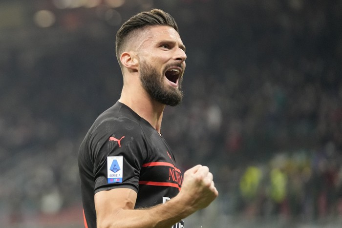 AC Milans Olivier Giroud celebrates after scoring his sides opening goal during a Serie A soccer match between AC Milan and Torino, at the San Siro stadium, in Milan, Italy, Tuesday, Oct. 26, 2021. (AP Photo/Luca Bruno)
