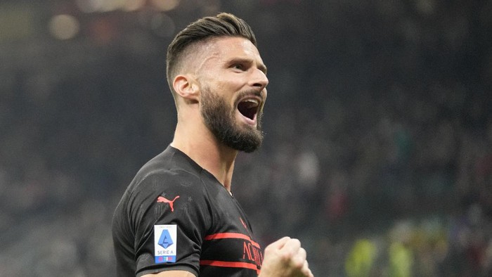 AC Milans Olivier Giroud celebrates after scoring his sides opening goal during a Serie A soccer match between AC Milan and Torino, at the San Siro stadium, in Milan, Italy, Tuesday, Oct. 26, 2021. (AP Photo/Luca Bruno)