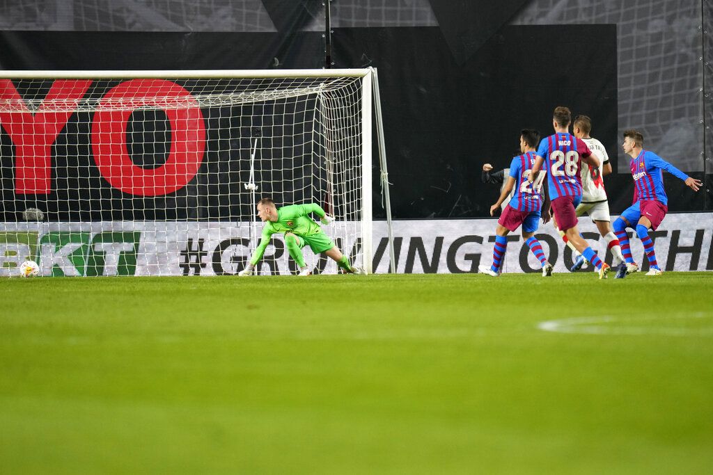 Barcelona's goalkeeper Marc-Andre ter Stegen, left, fails to save the ball as Rayo's Radamel Falcao scores the opening goal during a Spanish La Liga soccer match between Rayo Vallecano and FC Barcelona at the Vallecas stadium in Madrid, Spain, Wednesday, Oct. 27, 2021. (AP Photo/Manu Fernandez)