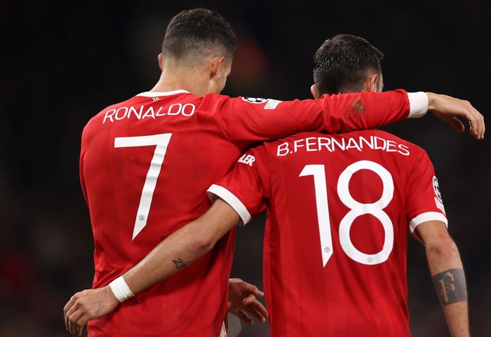 MANCHESTER, ENGLAND - OCTOBER 20: Cristiano Ronaldo of Manchester United interacts with Bruno Fernandes of Manchester United during the UEFA Champions League group F match between Manchester United and Atalanta at Old Trafford on October 20, 2021 in Manchester, England. (Photo by Naomi Baker/Getty Images)