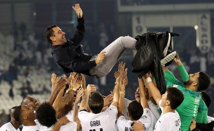 Xavi Hernandez Al-Sadd's Spanish coach Xavi is thrown into the air by his players as they celebrate winning the final match of the Qatar Cup against Al-Duhail at the Jassim Bin Hamad Stadium on January 17, 2020. - Al-Sadd won the match 4-0. (Photo by KARIM JAAFAR / AFP)