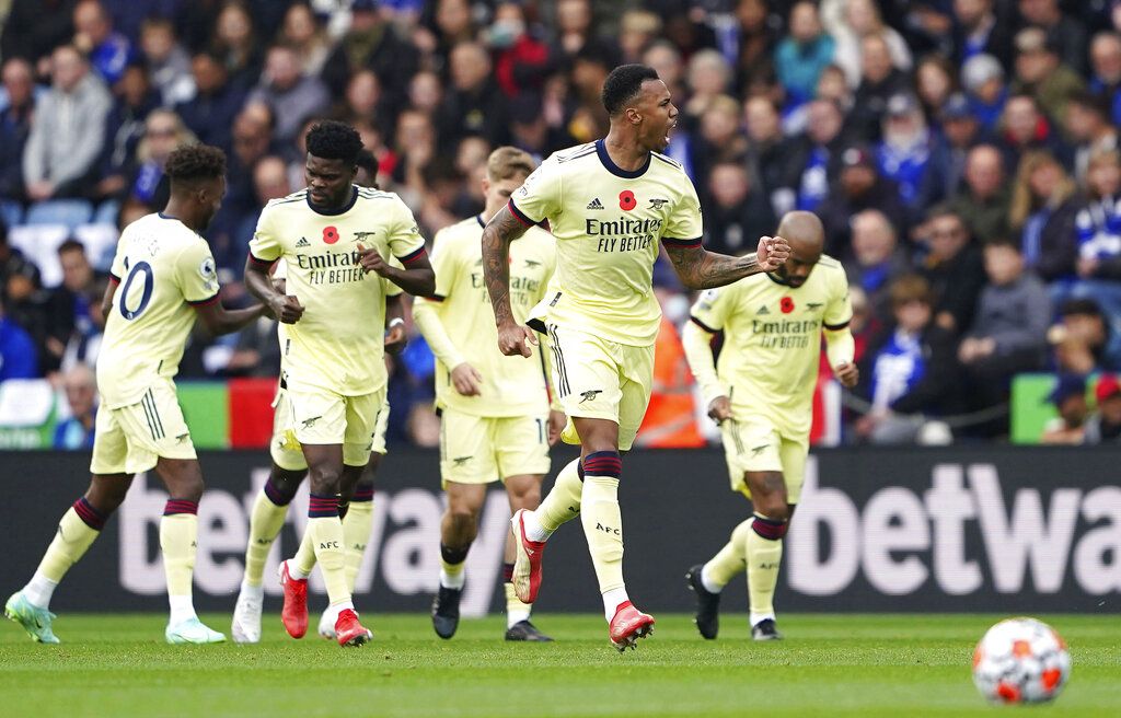 Arsenal's Gabriel Magalhaes celebrates after scoring his team's first goal, during the English Premier League soccer match between Leicester City and Arsenal, at the King Power Stadium, in Leicester, England, Saturday, Oct. 30, 2021. (Zac Goodwin/PA via AP)