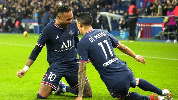 PSGs Angel Di Maria, right, celebrates with. teammate Neymar after scoring his sides second goal during French League One soccer match between Paris Saint-Germain and Lille at the Parc des Princes stadium in Paris, France, Friday, Oct. 29, 2021. (AP Photo/Michel Euler)