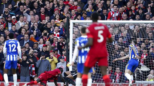Liverpool's Sadio Mane, 2nd left, scores his side's second goal during the English Premier League soccer match between Liverpool and Brighton and Hove Albion at Anfield Stadium, Liverpool, England, Saturday, Oct. 30, 2021. (AP Photo/Jon Super)