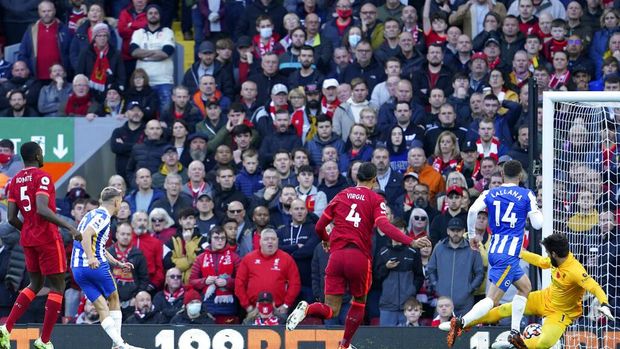 Brighton's Leandro Trossard, 2nd left, scores his side's second goal during the English Premier League soccer match between Liverpool and Brighton and Hove Albion at Anfield Stadium, Liverpool, England, Saturday, Oct. 30, 2021. (AP Photo/Jon Super)
