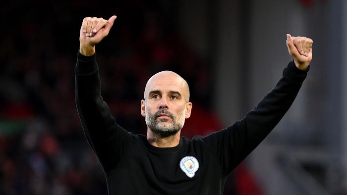 LIVERPOOL, ENGLAND - OCTOBER 03: Pep Guardiola, Manager of Manchester City acknowledges the fans following the Premier League match between Liverpool and Manchester City at Anfield on October 03, 2021 in Liverpool, England. (Photo by Michael Regan/Getty Images)