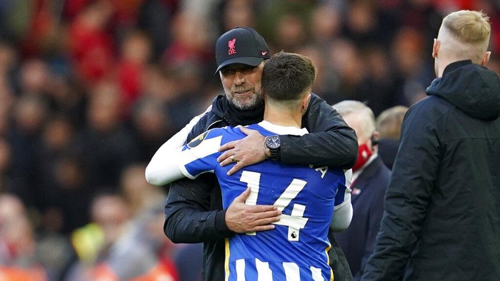 Liverpools manager Jurgen Klopp hugs Brightons Adam Lallana at the end of the English Premier League soccer match between Liverpool and Brighton and Hove Albion at Anfield Stadium, Liverpool, England, Saturday, Oct. 30, 2021. The game ended in a 1-1 draw. (AP Photo/Jon Super)