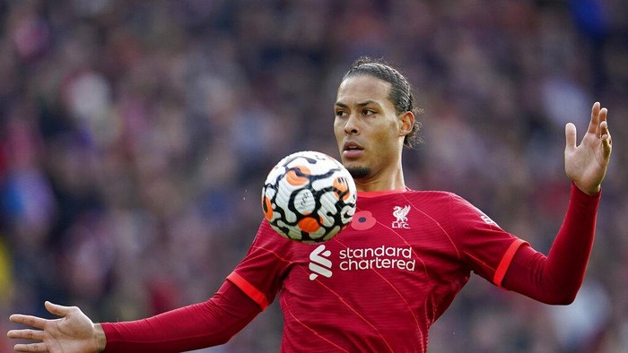 Liverpools Virgil van Dijk controls the ball during the English Premier League soccer match between Liverpool and Brighton and Hove Albion at Anfield Stadium, Liverpool, England, Saturday, Oct. 30, 2021. (AP Photo/Jon Super)