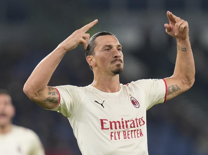 AC Milan's Zlatan Ibrahimovic celebrates after scoring his side's opening goal during the Series A soccer match between Roma and AC Milan at Rome's Olympic stadium, in Rome, Sunday, Oct. 31, 2021. (AP Photo/Gregorio Borgia)