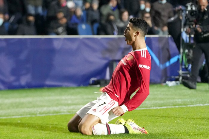 Manchester Uniteds Cristiano Ronaldo celebrates after scoring his sides second goal during the Champions League group F soccer match between Atalanta and Manchester United, at the Stadio di Bergamo, in Bergamo, Italy, Tuesday, Nov. 2, 2021. (AP Photo/Luca Bruno)
