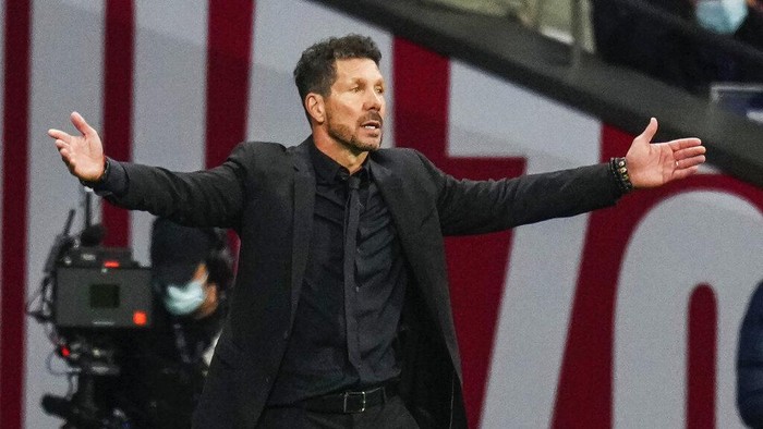 Atletico Madrids head coach Diego Simeone reacts during the La Liga soccer match between Atletico Madrid and Real Sociedad at the Estadio Wanda Metropolitano in Madrid, Sunday, Oct. 24, 2021. (AP Photo/Manu Fernandez)