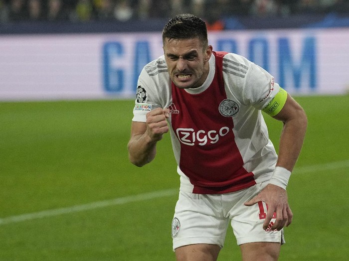 Ajax's Dusan Tadic celebrates after scoring his side's opening goal during the Champions League group C soccer match between Borussia Dortmund and Ajax Amsterdam in Dortmund, Germany, Wednesday, Nov. 3, 2021. (AP Photo/Martin Meissner)
