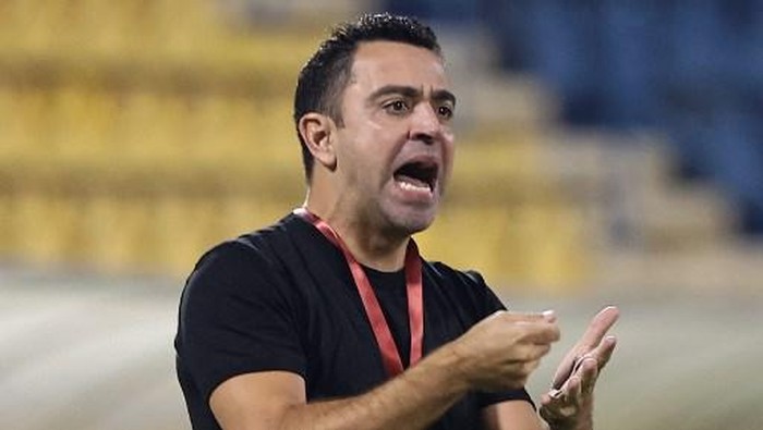 Qatari football club al-Sadd SCs Spanish coach Xavi Hernandez reacts during Qatar Stars League match between al-Sadd SC and al-Duhail SC, at Thani Bin Jassim Stadium (Al-Gharafah Stadium) in Qatars capital Doha on November 3, 2021. (Photo by KARIM JAAFAR / AFP)