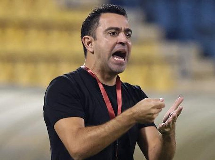 Qatari football club al-Sadd SC's Spanish coach Xavi Hernandez reacts during Qatar Stars League match between al-Sadd SC and al-Duhail SC, at Thani Bin Jassim Stadium (Al-Gharafah Stadium) in Qatar's capital Doha on November 3, 2021. (Photo by KARIM JAAFAR / AFP)