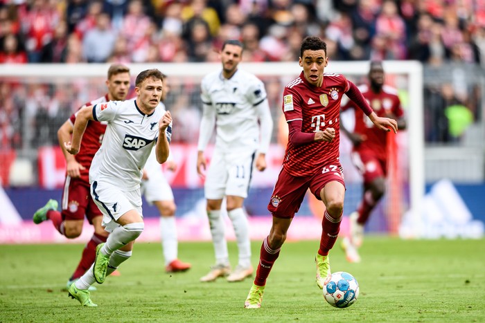 MUNICH, GERMANY - OCTOBER 23: Jamal Musiala of FC Bayern München runs with the ball during the Bundesliga match between FC Bayern München and TSG Hoffenheim at Allianz Arena on October 23, 2021 in Munich, Germany. (Photo by Sebastian Widmann/Bundesliga/Bundesliga Collection via Getty Images)