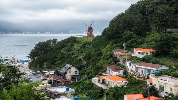 view of dojangpo fishing village and windmill in the distance. Taken in Geoje, South Korea