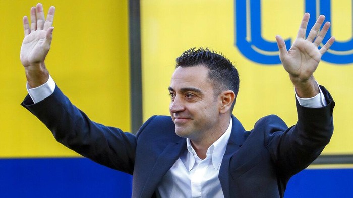 FC Barcelonas new coach Xavi Hernandez gestures during his official presentation at the Camp Nou stadium in Barcelona, Spain, Monday, Nov. 8, 2021. Xavi, who thrived in Barcelona’s midfield alongside Messi and Andres Iniesta, was officially introduced as coach on the field of the Camp Nou with a reception usually only offered to top players. (AP Photo/Joan Monfort)