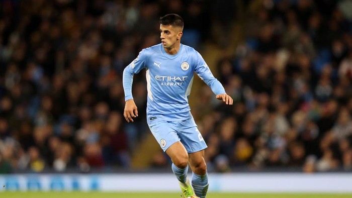 MANCHESTER, ENGLAND - NOVEMBER 03: Joao Cancelo of Manchester City in action during the UEFA Champions League group A match between Manchester City and Club Brugge KV at Etihad Stadium on November 03, 2021 in Manchester, England. (Photo by Naomi Baker/Getty Images)