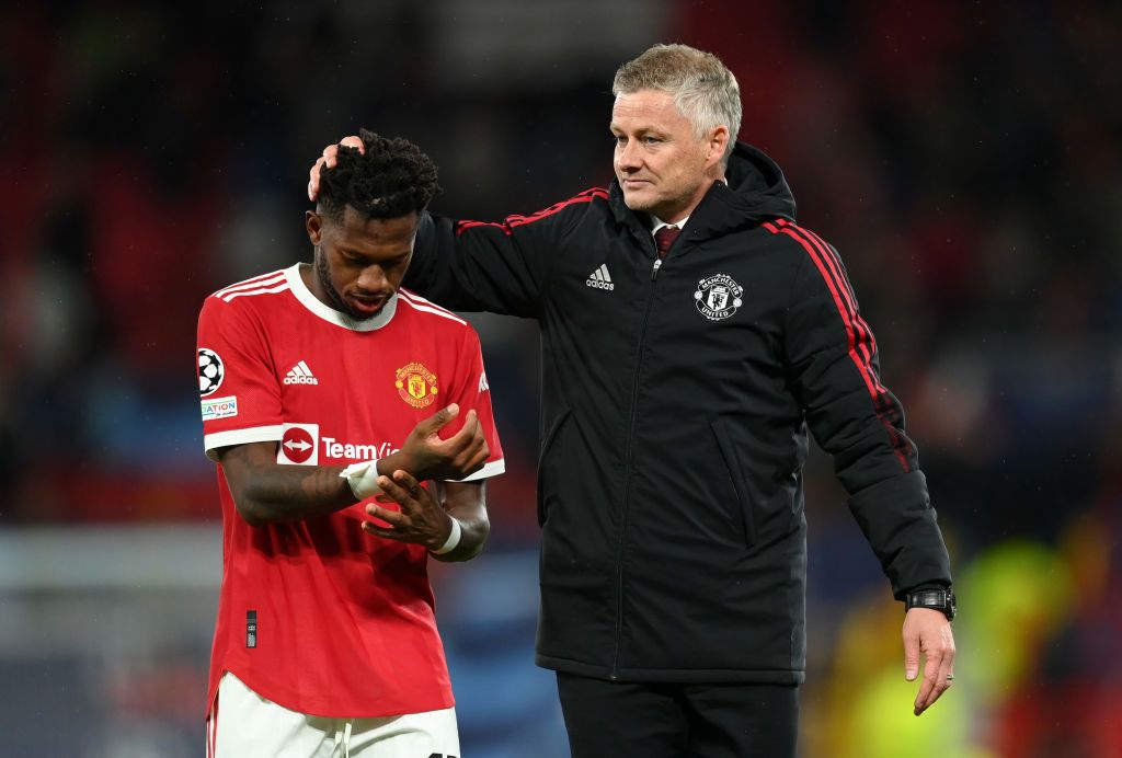 MANCHESTER, ENGLAND - SEPTEMBER 29: Fred of Manchester United is consoled by Ole Gunnar Solskjaer, Manager of Manchester United after the UEFA Champions League group F match between Manchester United and Villarreal CF at Old Trafford on September 29, 2021 in Manchester, England. (Photo by Michael Regan/Getty Images)