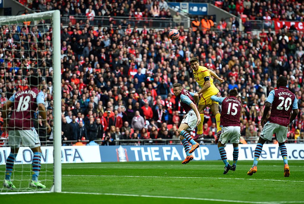 LIVERPOOL, ENGLAND - SEPTEMBER 13: Steven Gerrard of Liverpool is tackled by Fabian Delph of Aston Villa during the Barclays Premier League match between Liverpool and Aston Villa at Anfield on September 13, 2014 in Liverpool, England.  (Photo by Alex Livesey/Getty Images)