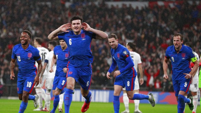 Englands Harry Maguire celebrates after he scores his sides first goal during the World Cup 2022 group I qualifying soccer match between England and Albania at Wembley stadium in London, Friday, Nov. 12, 2021. (AP Photo/Ian Walton)