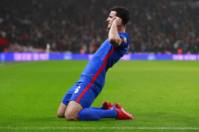 Englands Harry Maguire celebrates after he scores his sides first goal during the World Cup 2022 group I qualifying soccer match between England and Albania at Wembley stadium in London, Friday, Nov. 12, 2021. (AP Photo/Ian Walton)