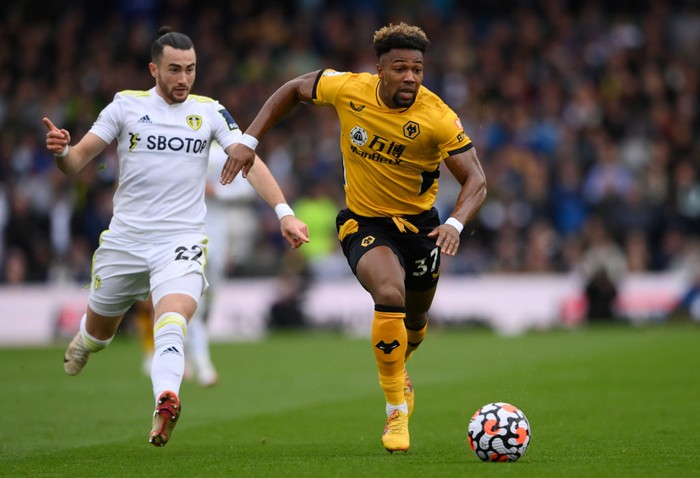 Adama Traore LEEDS, ENGLAND - OCTOBER 23: Adama Traore of Wolverhampton Wanderers breaks away from Jack Harrison of Leeds United during the Premier League match between Leeds United and Wolverhampton Wanderers at Elland Road on October 23, 2021 in Leeds, England. (Photo by Stu Forster/Getty Images)