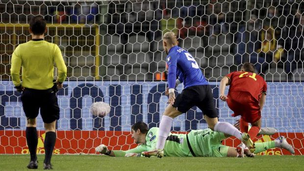 Estonia's Erik Sorga, center, scores his sides first goal during the World Cup 2022 group E qualifying soccer match between Belgium and Estonia at the King Baudouin stadium in Brussels, Saturday, Nov. 13, 2021. (AP Photo/Olivier Matthys)