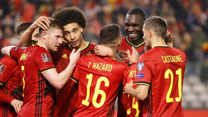 Belgiums Thorgan Hazard, center, is congratulated after scoring his sides third goal during the World Cup 2022 group E qualifying soccer match between Belgium and Estonia at the King Baudouin stadium in Brussels, Saturday, Nov. 13, 2021. (AP Photo/Olivier Matthys)