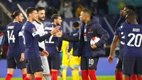 Timnas Prancis lolos ke Piala Dunia 2022 setelah mengalahkan Finlandia pada laga terakhir Grup D Kualifikasi Zona Eropa. Kemenangan atas Finlandia mengantar Prancis ke puncak klasemen akhir Grup D berkat raihan 18 poin dari delapan pertandingan. AP/Michel Euler.