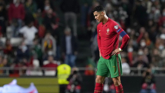 Portugals Cristiano Ronaldo reacts after Serbias Aleksandar Mitrovic scoring his sides second goal during the World Cup 2022 group A qualifying soccer match between Portugal and Serbia at the Luz stadium in Lisbon, Sunday, Nov 14, 2021. (AP Photo/Armando Franca)