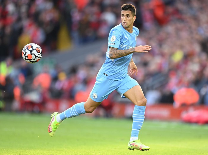 MANCHESTER, ENGLAND - AUGUST 21:  Joao Cancelo of Manchester City controls the ball during the Premier League match between Manchester City  and  Norwich City at Etihad Stadium on August 21, 2021 in Manchester, England. (Photo by Shaun Botterill/Getty Images )