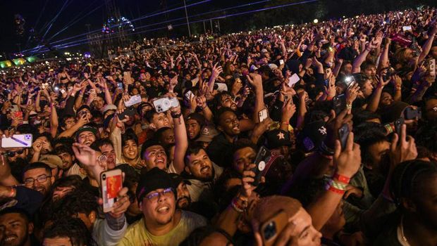 FILE - The crowd watches as Travis Scott performs at Astroworld Festival at NRG park on Friday, Nov. 5, 2021 in Houston. (Jamaal Ellis/Houston Chronicle via AP, File)