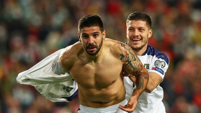 LISBON, PORTUGAL - NOVEMBER 14: Aleksandar Mitrovic of Serbia celebrates scoring Serbia second and wining goal during the 2022 FIFA World Cup Qualifier match between Portugal and Serbia at Estadio Jose Alvalade on November 14, 2021 in Lisbon, Lisboa. (Photo by Carlos Rodrigues/Getty Images)