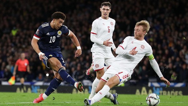 GLASGOW, SCOTLAND - NOVEMBER 15: Che Adams of Scotland shoots as Simon Kjaer of Denmark attempts to block during the 2022 FIFA World Cup Qualifier match between Scotland and Denmark at Hampden Park on November 15, 2021 in Glasgow, Scotland. (Photo by Ian MacNicol/Getty Images)