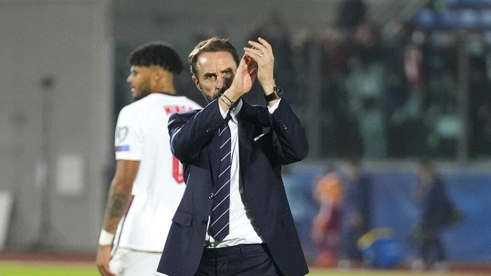 England coach Gareth Southgate applauds spectators after the World Cup 2022 group I qualifying soccer match between San Marino and England at Olympic Stadium, in Serravalle, San Marino, Monday, Nov. 15, 2021. England won the match 10-0. (AP Photo/Antonio Calanni)