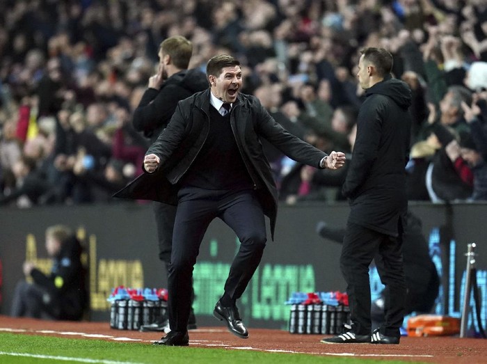 Aston Villas Ollie Watkins celebrates scoring the opening goal with Leon Bailey during the Premier League match at Villa Park, Birmingham, Britain, Saturday Nov. 20, 2021.  (Bradley Collyer/PA via AP)