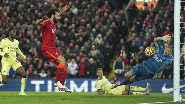 Liverpool's Mohamed Salah scores his side's third goal during the English Premier League soccer match between Liverpool and Arsenal at Anfield Stadium, Liverpool, England, Saturday, Nov. 20, 2021. (AP Photo/Jon Super)