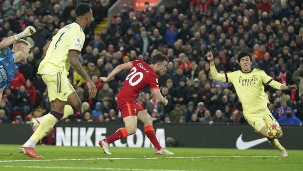 Liverpool's Diogo Jota, centre, scores his side's second goal during the English Premier League soccer match between Liverpool and Arsenal at Anfield Stadium, Liverpool, England, Saturday, Nov. 20, 2021. (AP Photo/Jon Super)