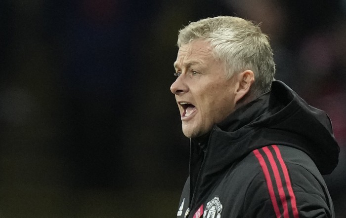 Manchester United's manager Ole Gunnar Solskjaer gives instructions to his players during the English Premier League soccer match between Watford and Manchester United at Vicarage Road, Watford, England, Saturday, Nov. 20, 2021. (AP Photo/Frank Augstein)