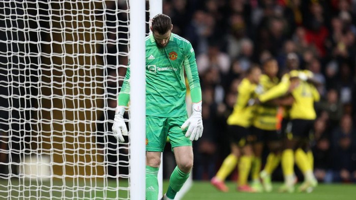 Watford Vs MU, David De Gea WATFORD, ENGLAND - NOVEMBER 20: David De Gea of Manchester United looks dejected after conceding the first goal during the Premier League match between Watford and Manchester United at Vicarage Road on November 20, 2021 in Watford, England. (Photo by Alex Pantling/Getty Images)