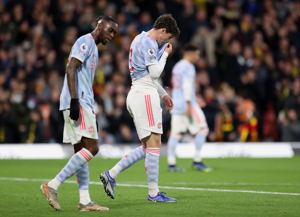 WATFORD, ENGLAND - NOVEMBER 20: Aaron Wan-Bissaka and Victor Lindeloef of Manchester United look dejected after conceding a second goal during the Premier League match between Watford and Manchester United at Vicarage Road on November 20, 2021 in Watford, England. (Photo by Alex Pantling/Getty Images)